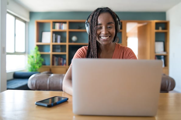 Woman learning HTML5 on laptop